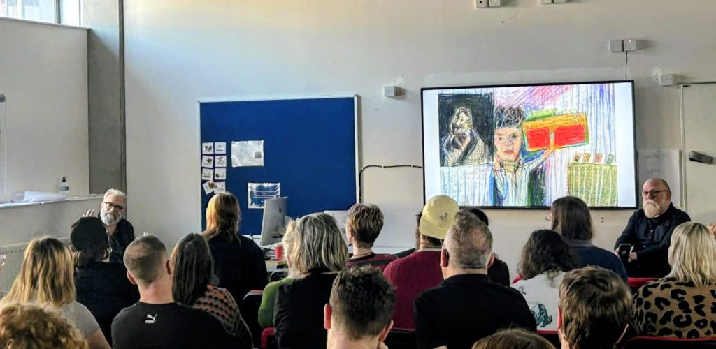 Artist, critic, authorand presenter Matthew Collings giving a talk on his drawing practice to CAPetc... students in a lecture room at Edinburgh College.